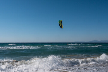 The image of windsurfing with parachute, which is among the extreme sports.