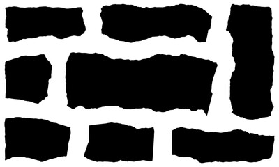 Collection of torn black paper fragments