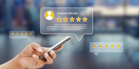 Customer Reviews on Mobile Phone: Hand Holding Smartphone with Five Star Rating Feedback, Online Reputation Management and Satisfaction Concept