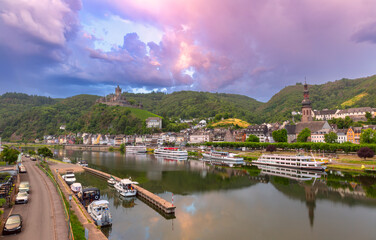 Fototapeta premium View of Reichsburg on the hill and Moselle river at dawn in Cochem, Germany