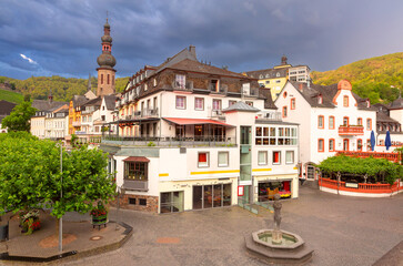 Historic market square with fountain and tower in Cochem, Germany
