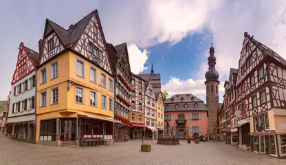 Half timbered buildings and church tower on market square in Cochem, Germany