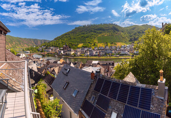 View from rooftop with solar panels toward Moselle river and hills in Cochem, Germany