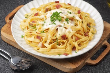 Fettuccine carbonara is a creamy pasta sauce made from a mixture of cream, cheese, and eggs.