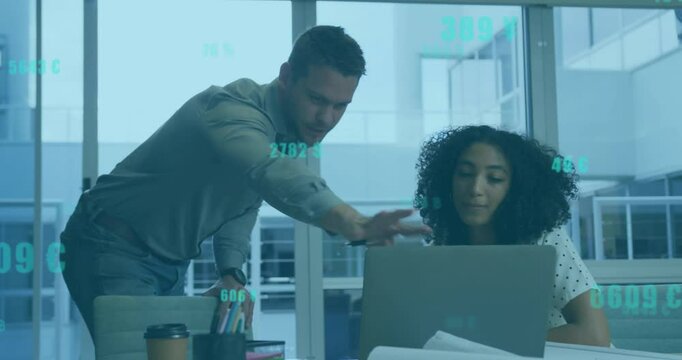 Man leaning over laptop and guiding woman with animated highlights showing business data