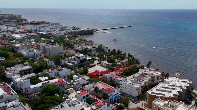 Aerial drone landscape view of playa del carmen downtown area with blue Caribbean Sea and blue sky on a sunny morning