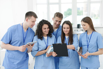 Group of medical students in uniforms indoors