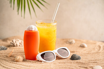 Sunblock or sunscreen in cosmetic tube on beach sand and beige background. Summer vacation and skin care concept with starfish and sea shells, spf uv-protect cosmetics. Skin health. High quality photo