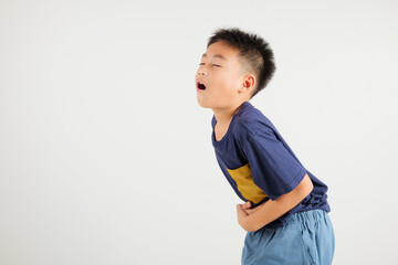 Portrait of Asian young kid boy has stomachache, primary child abdominal pain suffering from stomach ache, studio shot isolated on white background, food poisoning, Health and medical gastritis