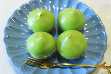 Thai Coconut Milk and Tapioca Starch Pudding Blended with Pandan Leaf Juice Called Kanom Piak Poon...