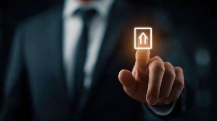 Businessman in a suit touching a digital upload icon.