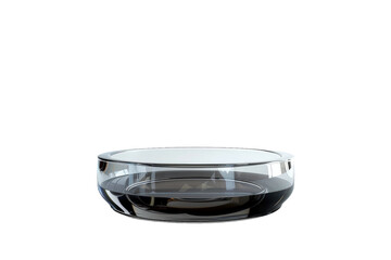 Elegant cigar placed in clear ashtray on grey surface.