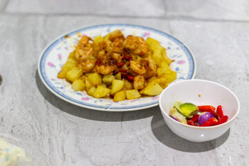 Shrimp and Potato Dish with Condiments