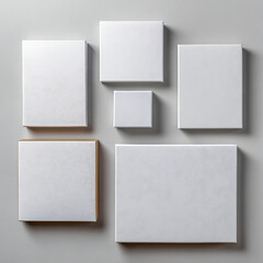 White canvases arranged on gray surface blank square