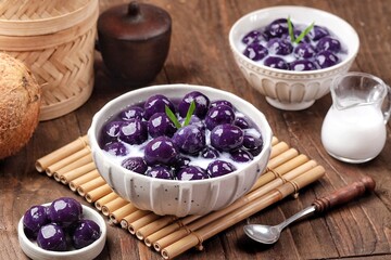 Biji Salak Ubi Ungu. Purple sweet potato salak seeds are a ball-shaped snack made from a mixture of starch and sweet potato