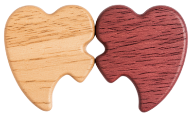 Two interlocking wooden puzzle pieces shaped like heart halves in natural and reddish wood tones.