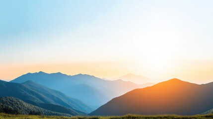 Fototapeta premium Serene landscape of rolling hills and soft mountains glowing under golden twilight, with clear blue sky and vibrant sunlight creating peaceful atmosphere