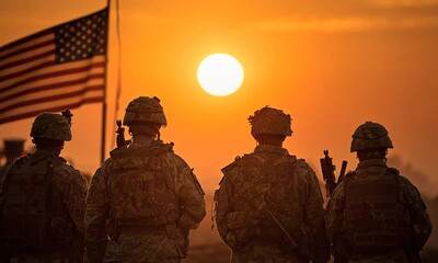 Soldiers at sunset, in camo, watching the sunrise, with flag. Could be used for military, veterans themes - Powered by Adobe