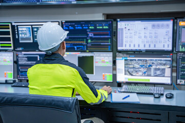 Engineer working at control room, Manager control system, Technician man monitoring program from a...