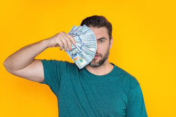 Successful business man counting money. Handsome middle age man holding bunch of 100 dollar...