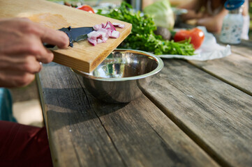 Close-Up of Vegetables Being Prepared Outdoors on a Wooden Surface