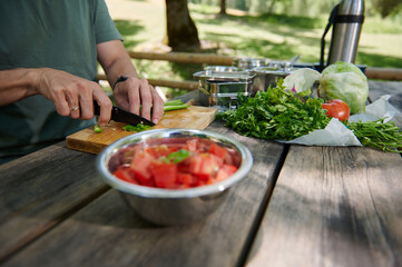 Outdoor Vegetable Preparation on Wooden Table in Sunny Nature