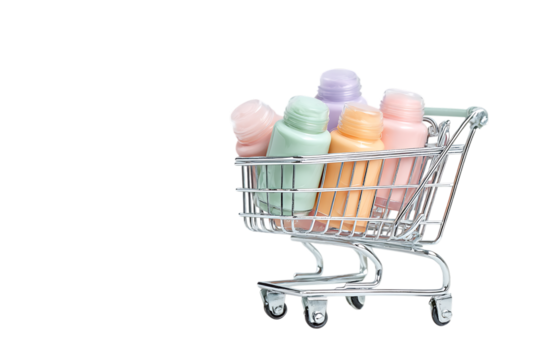 Pastel colored bath bombs in a miniature shopping cart.