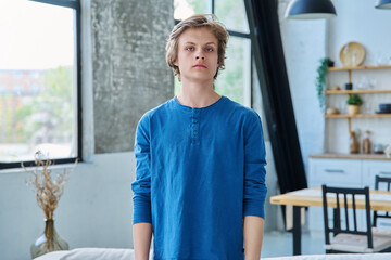Portrait of confident serious handsome teenage boy
