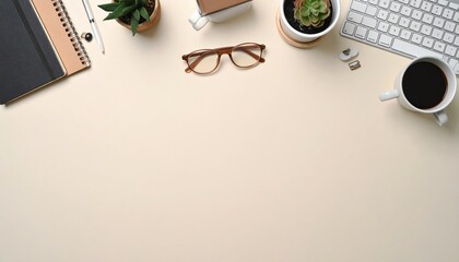 Minimal home office desk workspace with coffee, glasses, keyboard, and plants. Top view with copy space.