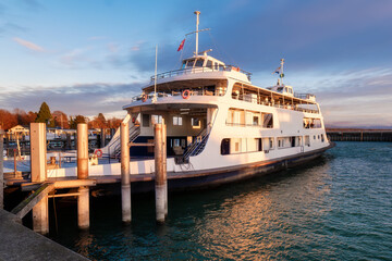 Ferry in Evening Light at the Harbor. Ferry in Evening Light at the Harbor. Tourism and Travel...