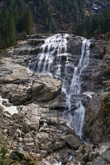 Neustift im Stubaital, Austria - April 20, 2025 - Grawa Observatory - waterfall in the Stubai Valley at Easter time