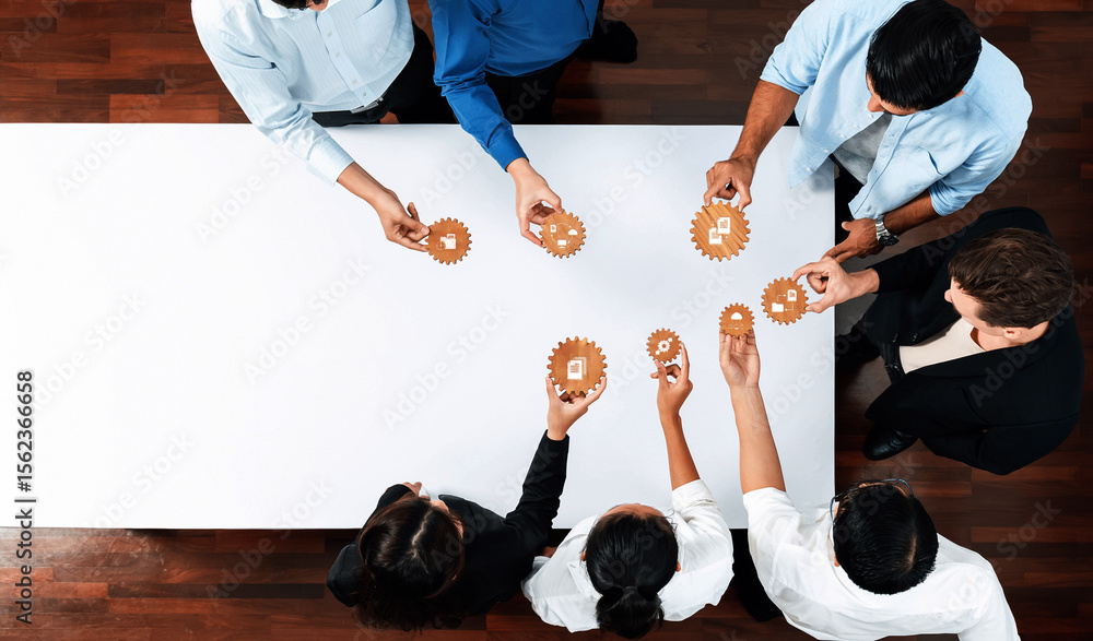 Poster A diverse team of professionals collaborates on project management strategies by interacting with gear models, fostering innovation and teamwork in a modern office environment. Amity