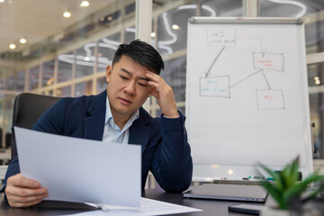 Young asian manager working in the office on a new project