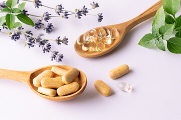 Set of tablets and pills for well sleep and relax with natural herbal ingredients on white...