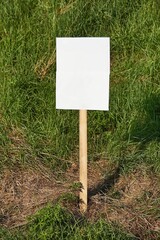 Empty sign on a land, green grass