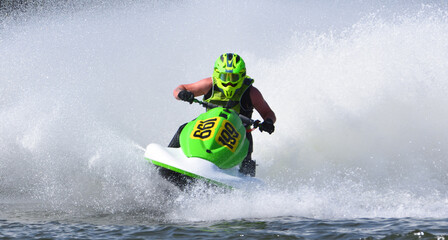  Jet Ski racer cornering at speed making lots of spray 