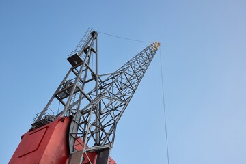 Old dock freight crane in a cargo port
