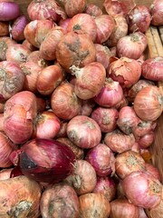 Pile of red onion at market stall