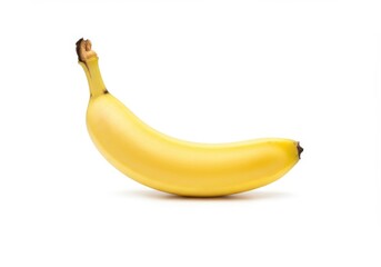 A single ripe yellow banana is isolated on white background, showcasing its smooth skin and curved shape