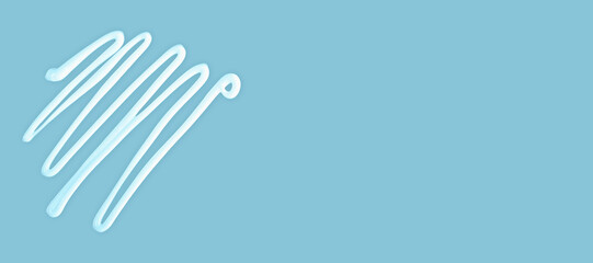 Cream lines on sky blue background with copy space, cream design represents skincare, beauty and...