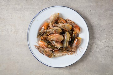 fresh shrimp head in white plate, ingredients for cooking