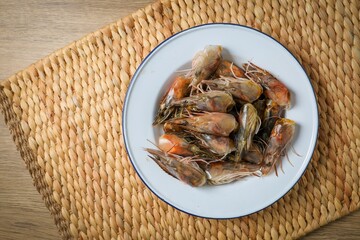 fresh shrimp head in white plate, ingredients for cooking