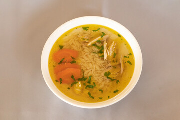 chicken broth with noodles and carrots