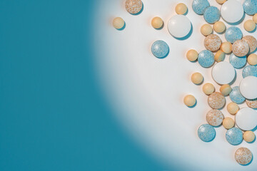 Close up of different medical pills on white background with blue shadows