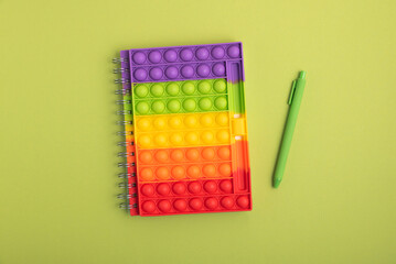 Back to school concept. Border made of school supplies on green background. Top view. Copy space