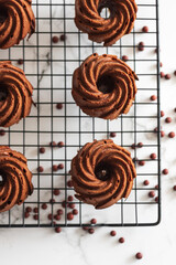 Mini chocolate bundt cakes on a cooling rack. Top view