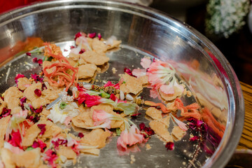 Wedding Thali: Aromatic Flowers, Snacks, and Holy Thread, a perfect combo. Indian tradition with...