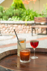 Clear fresh cocktail in a glass on the street on a sunny day