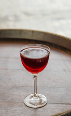 Clear fresh cocktail in a glass on the street on a sunny day