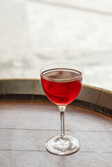 Clear fresh cocktail in a glass on the street on a sunny day